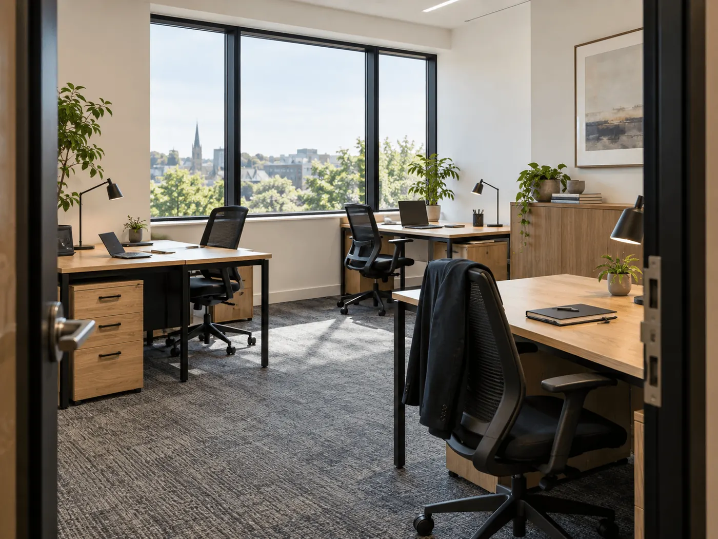 Office with two desks, pedestals and a tall window
